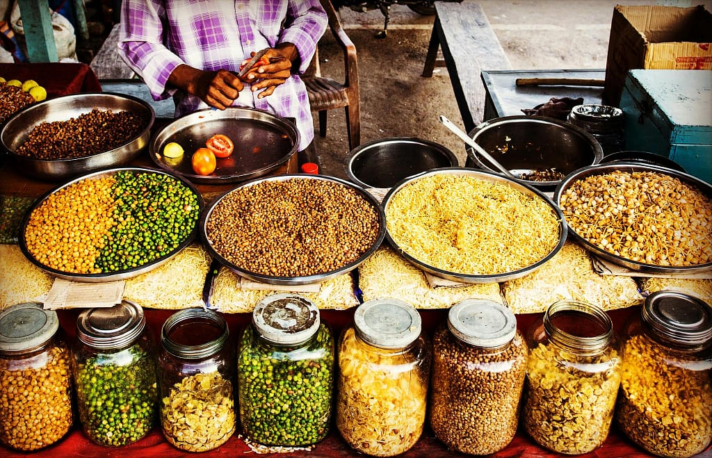 pexels-photo-618491-618491 Colorful display of spices and legumes in a traditional Indian street market.