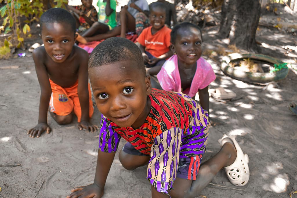 pexels-photo-31709503-31709503 A joyful group of African children playing together outside in Monrovia, Liberia, on a sunny day.