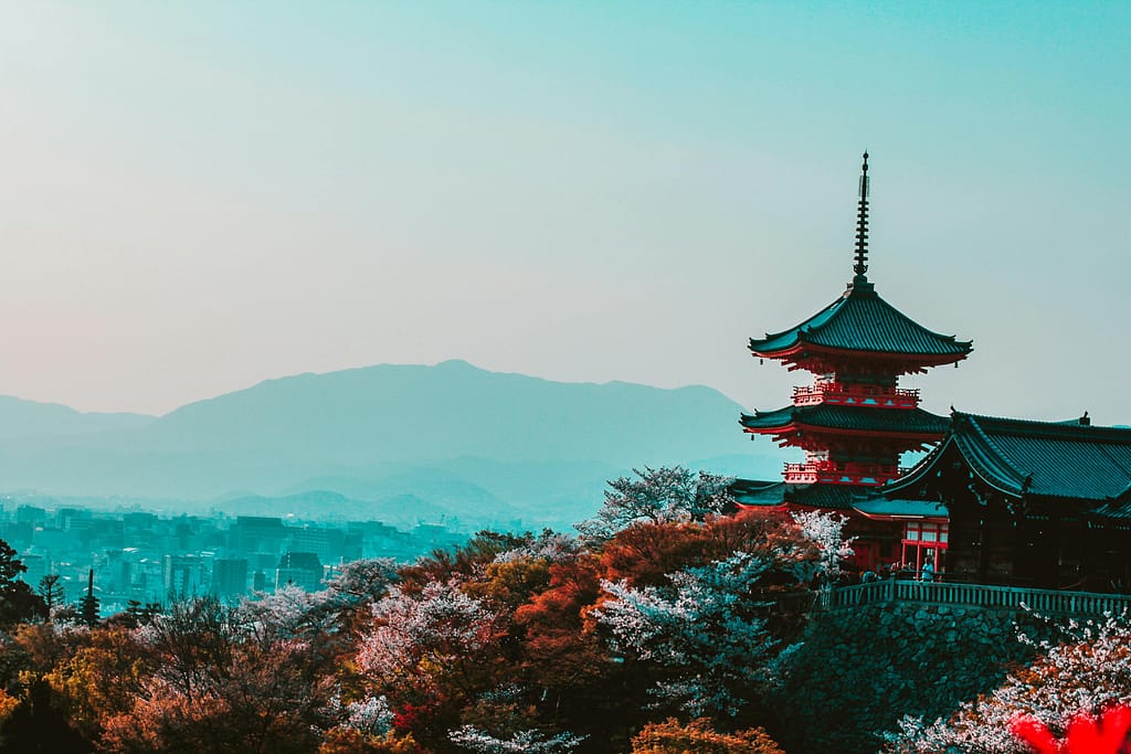 pexels-photo-402028-402028 Scenic view of Kiyomizu-dera Temple with cherry blossoms in Kyoto, Japan, capturing traditional Japanese architecture at twilight.