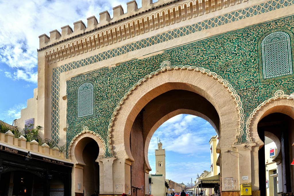 Majestic view of the ornate Bab Bou Jeloud gate in vibrant Fes, Morocco.