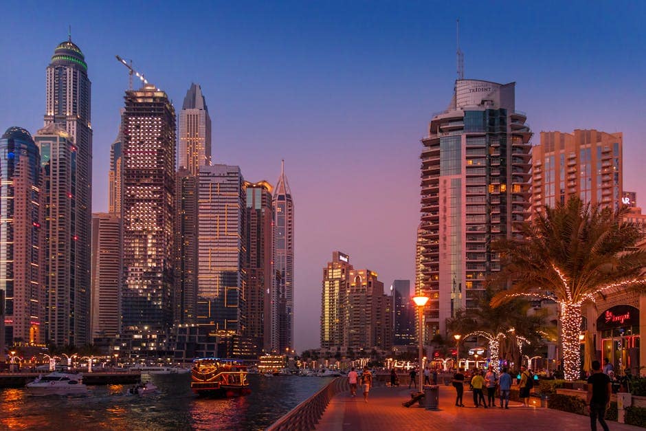 pexels-photo-1470502-1470502 A stunning view of the Dubai Marina skyline illuminated at sunset, showcasing urban city life.